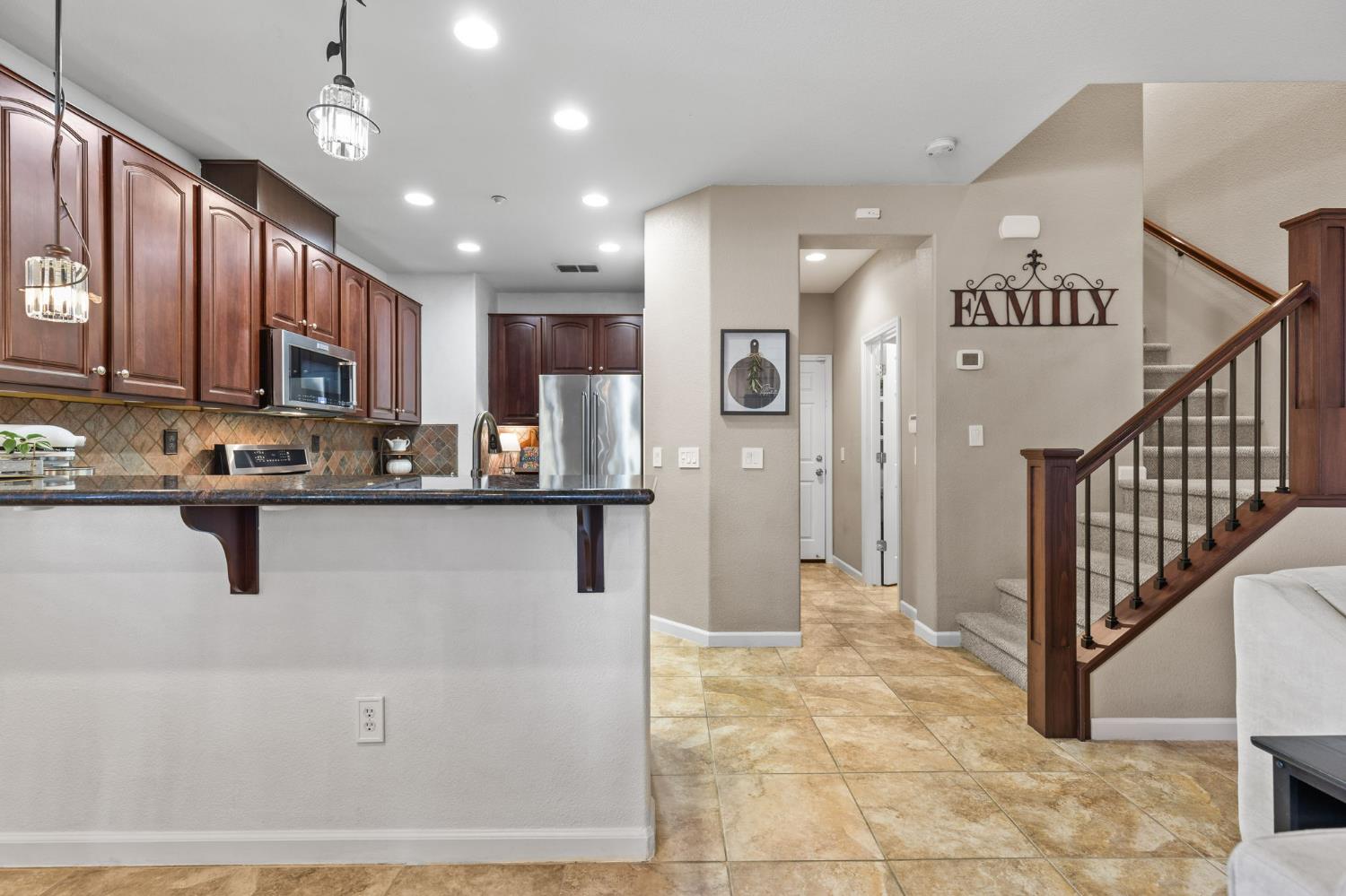 1107 Hudson Circle Lincoln, CA 95648 - Photo 14 of 51 a kitchen with stainless steel appliances granite countertop a refrigerator a oven and a sink with cabinets