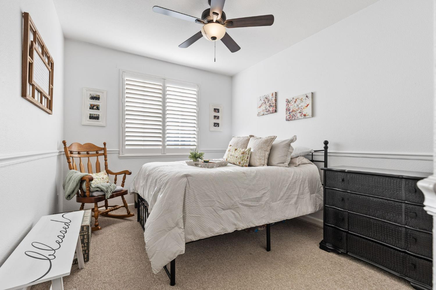 1107 Hudson Circle Lincoln, CA 95648 - Photo 29 of 51 a bedroom with a bed and a chandelier