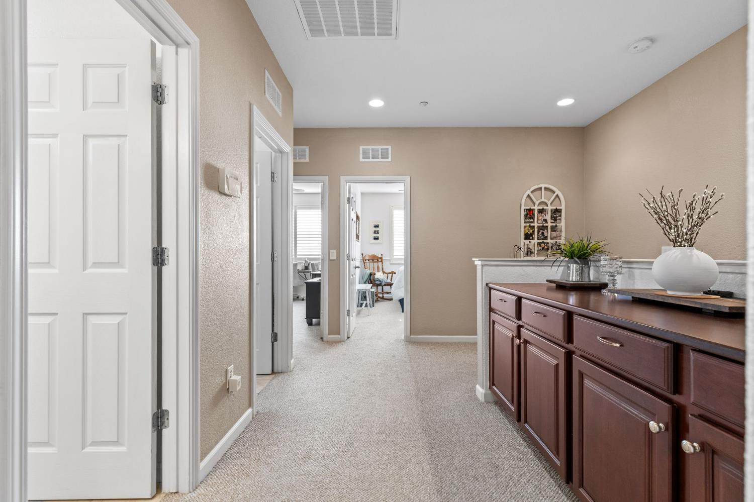 1107 Hudson Circle Lincoln, CA 95648 - Photo 31 of 51 a hallway with a sink and a large mirror