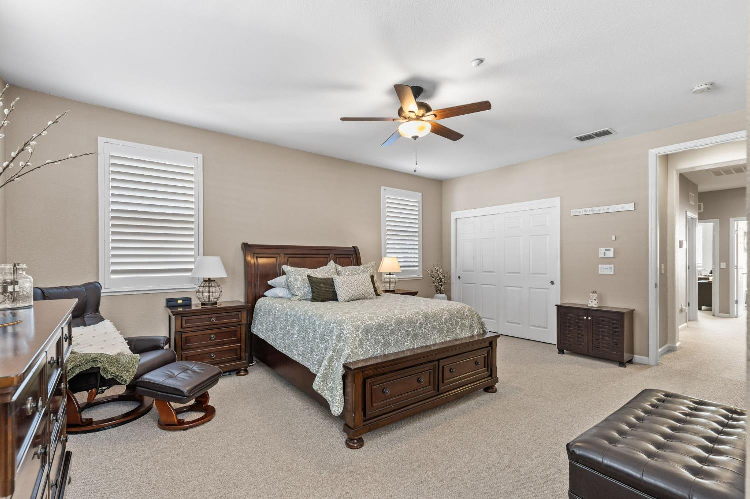 1107 Hudson Circle Lincoln, CA 95648 - Photo 38 of 51 a spacious bedroom with a bed and a chandelier