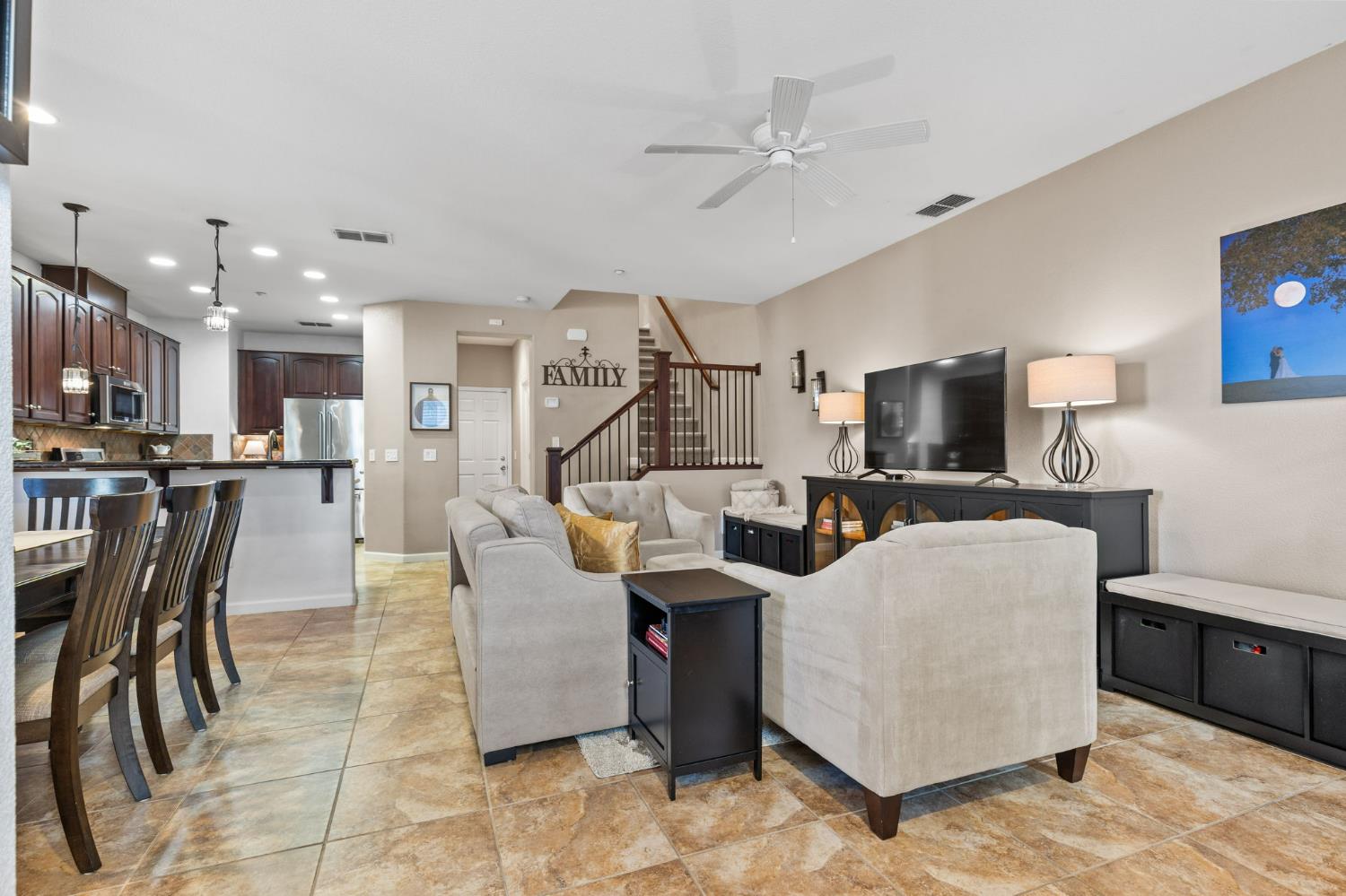 1107 Hudson Circle Lincoln, CA 95648 - Photo 4 of 51 a living room with furniture a flat screen tv and kitchen view