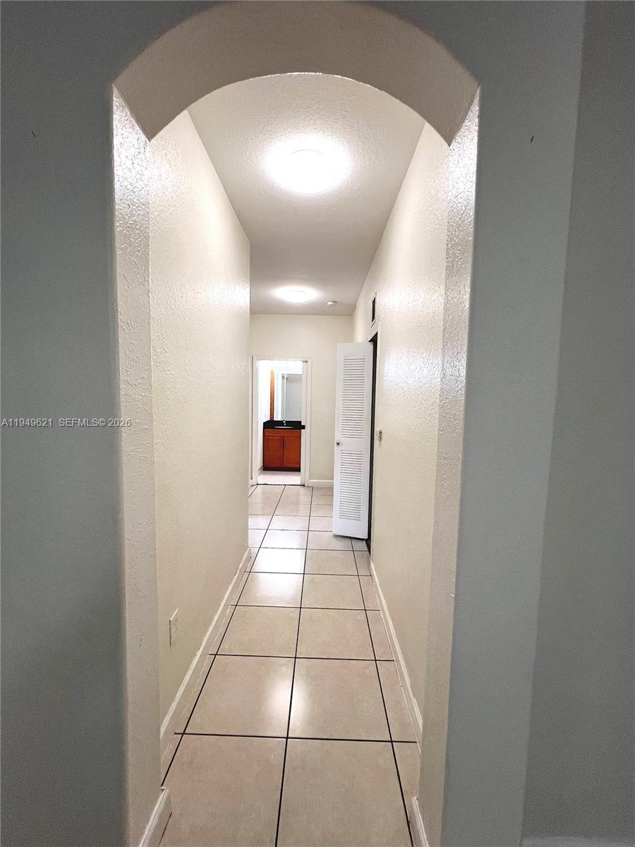 1660 Southeast 29th Street, Unit 101 Homestead, FL 33035 - Photo 11 of 18 a view of a hallway