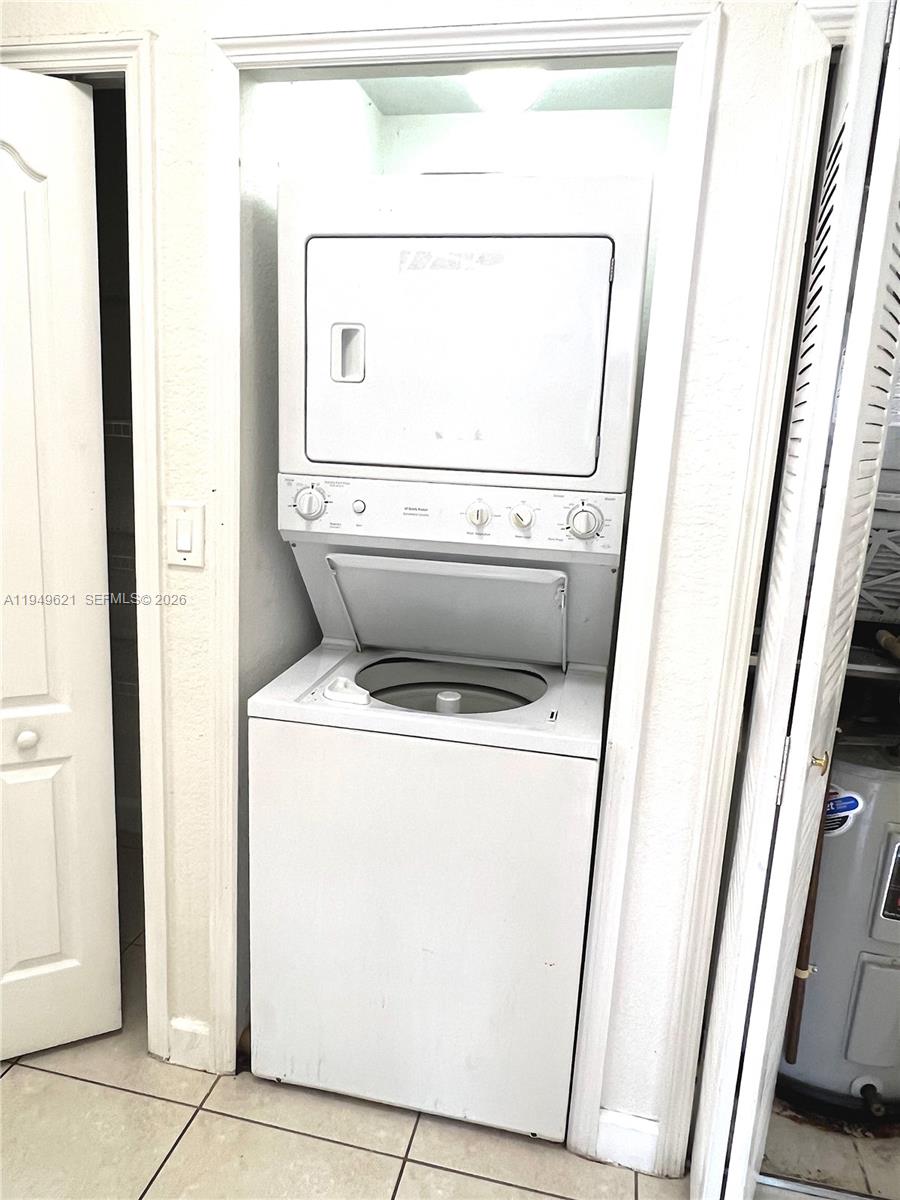 1660 Southeast 29th Street, Unit 101 Homestead, FL 33035 - Photo 13 of 18 a utility room with dryer and washer