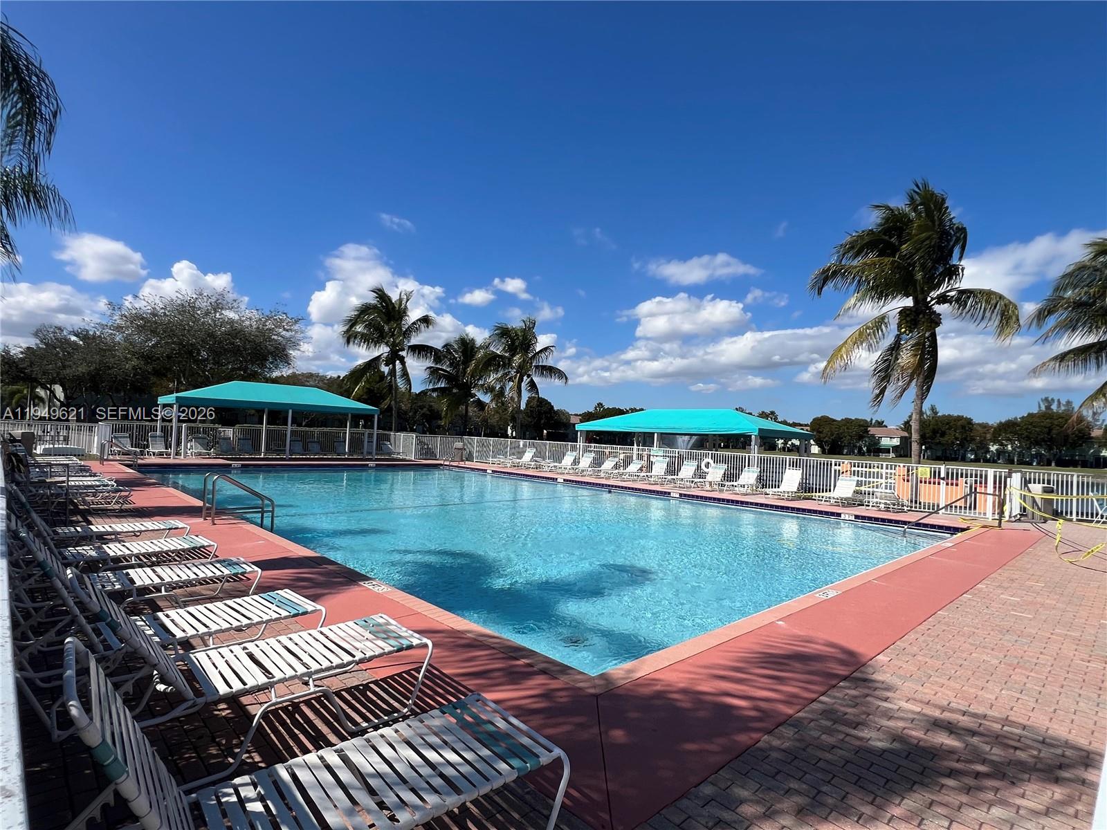 1660 Southeast 29th Street, Unit 101 Homestead, FL 33035 - Photo 15 of 18 a view of a swimming pool with a lake view
