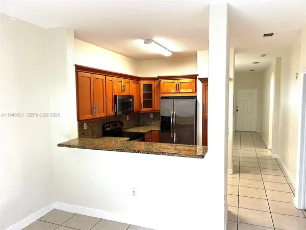 a view of a very nice looking living room with a large window