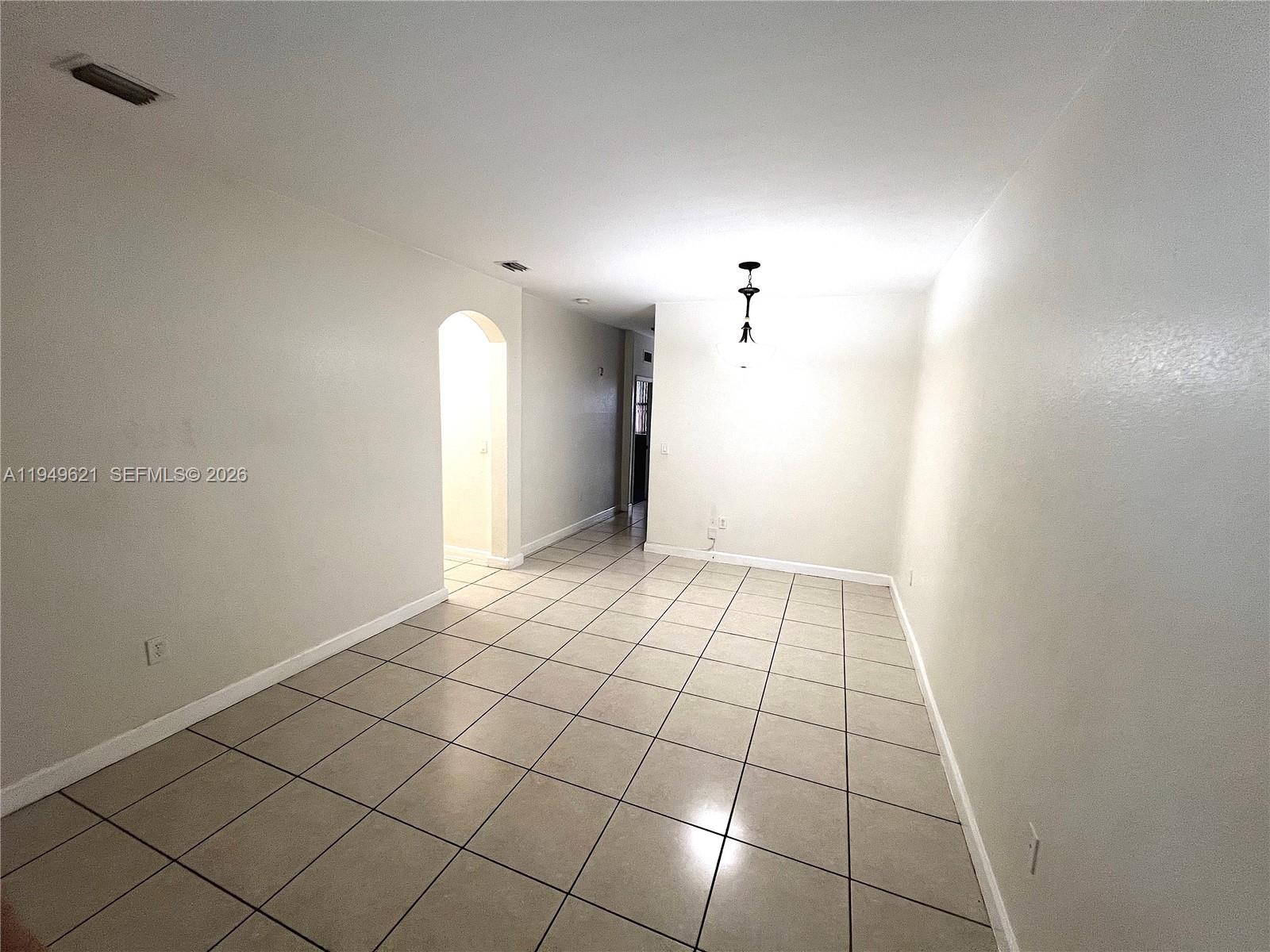 1660 Southeast 29th Street, Unit 101 Homestead, FL 33035 - Photo 7 of 18 a view of an empty room