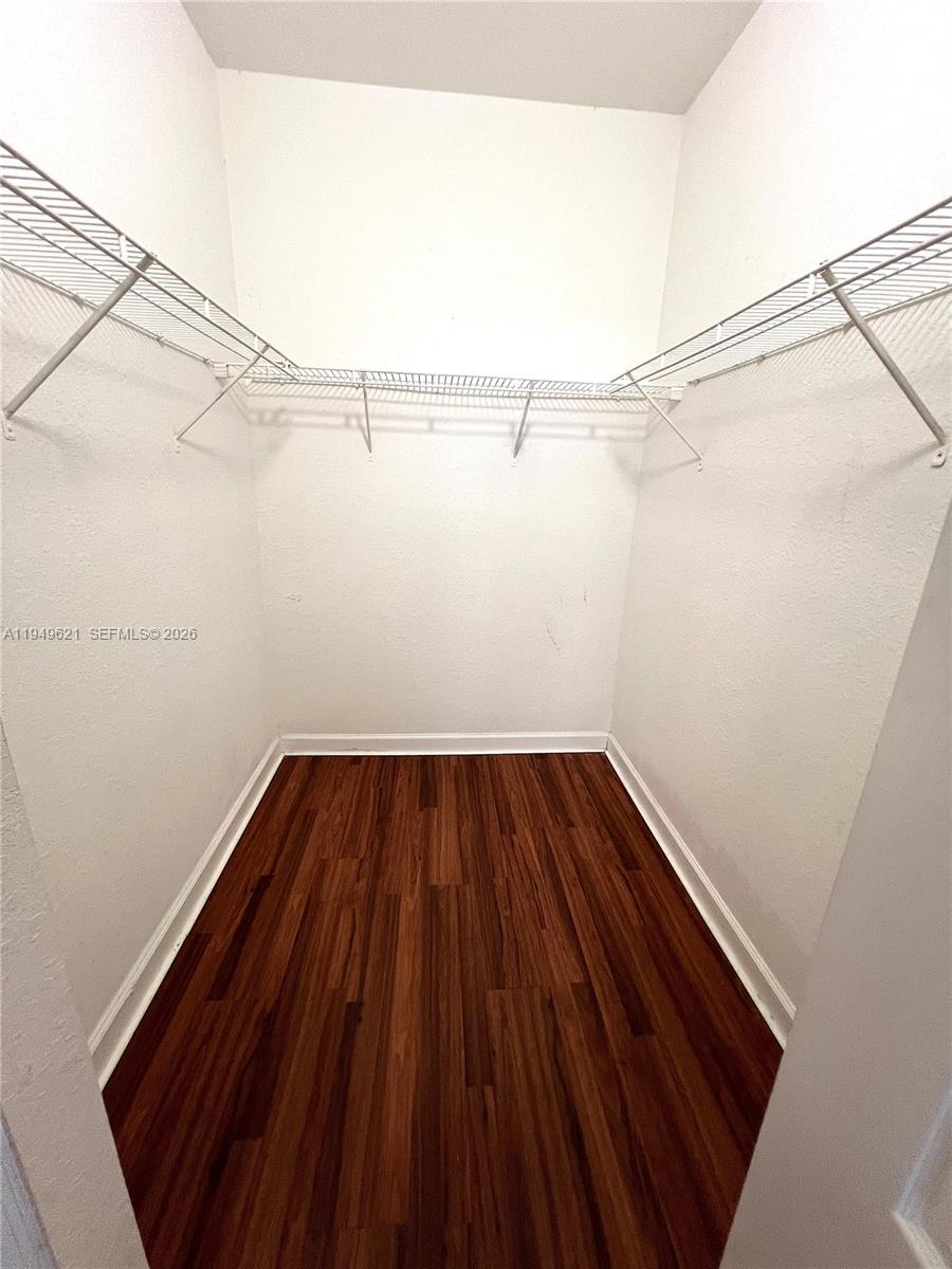 1660 Southeast 29th Street, Unit 101 Homestead, FL 33035 - Photo 10 of 18 a view of a room with racks on the wall