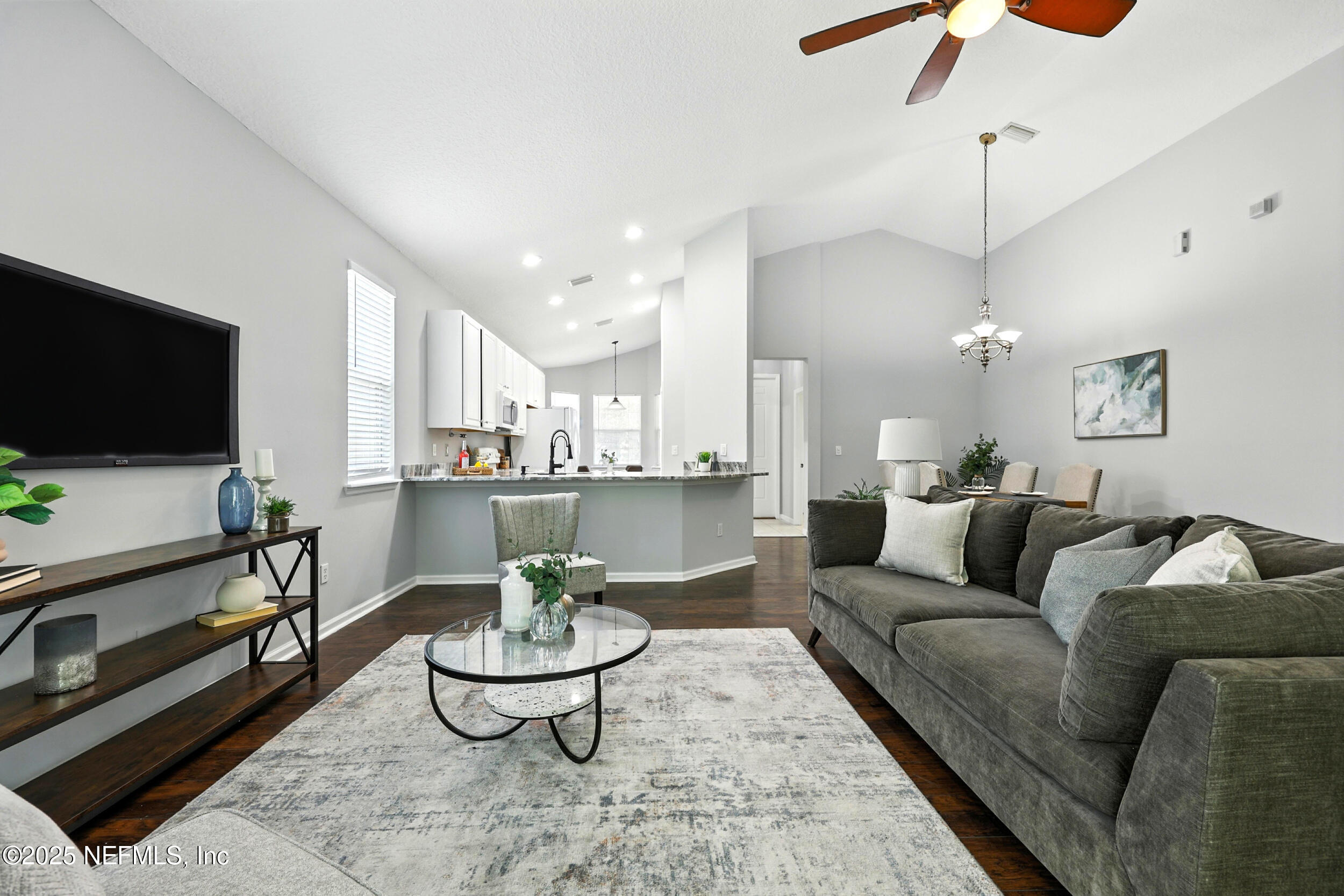 778 Copperhead Circle St. Augustine, FL 32092 - Photo 11 of 43 a living room with furniture and a flat screen tv