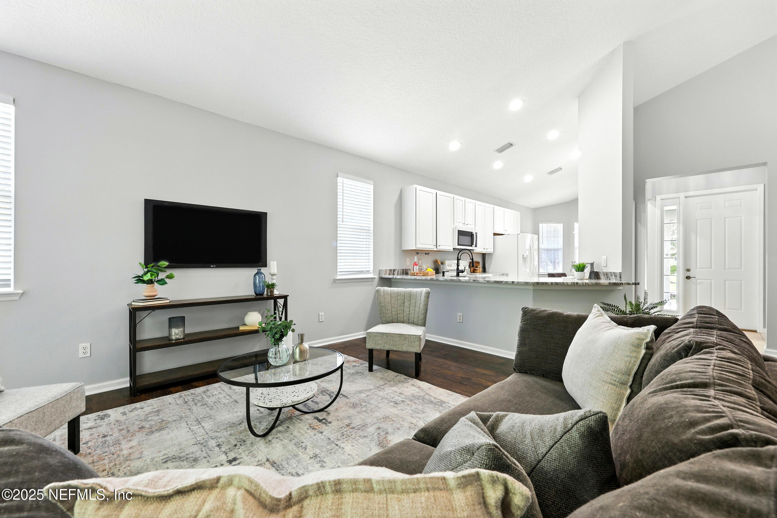 778 Copperhead Circle St. Augustine, FL 32092 - Photo 12 of 43 a living room with furniture and a flat screen tv