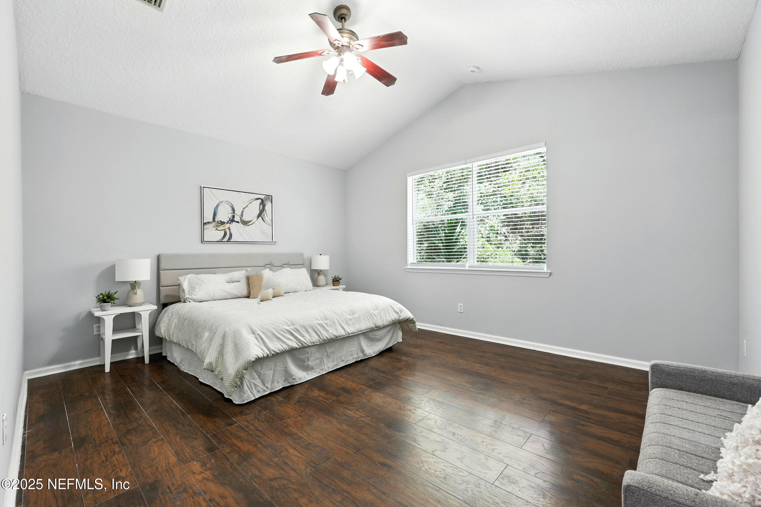 778 Copperhead Circle St. Augustine, FL 32092 - Photo 14 of 43 a bedroom with a bed and wooden floor