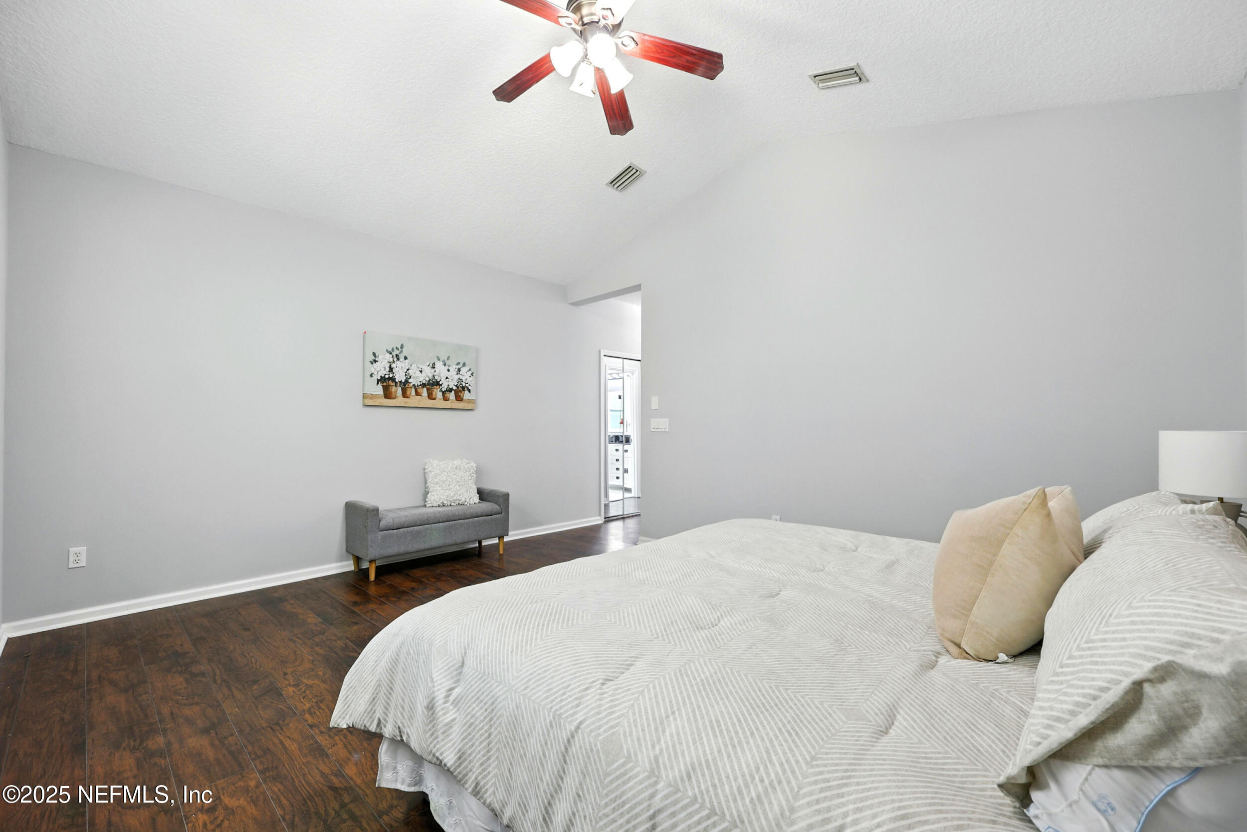 778 Copperhead Circle St. Augustine, FL 32092 - Photo 15 of 43 a bedroom with a bed and a chandelier