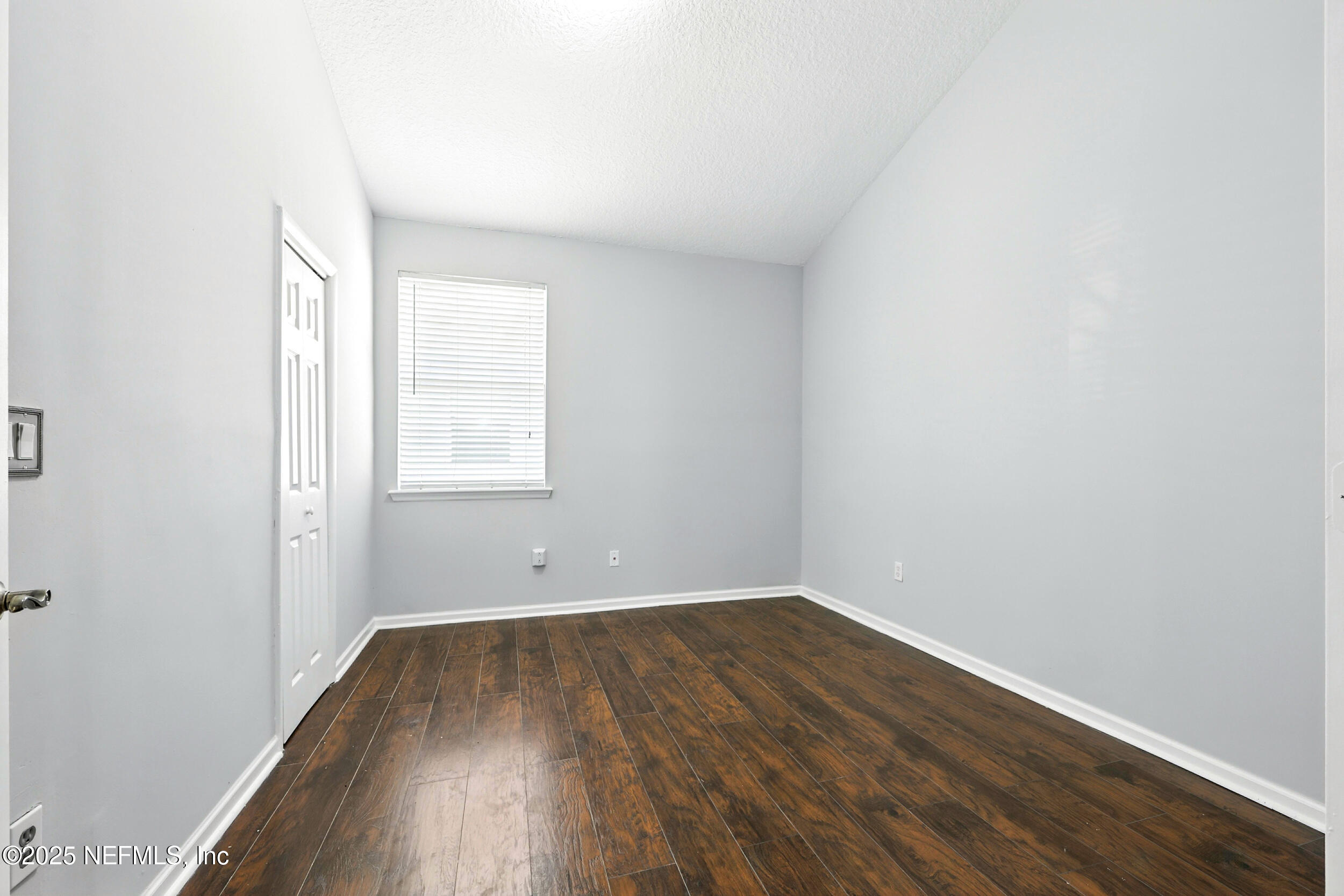 778 Copperhead Circle St. Augustine, FL 32092 - Photo 16 of 43 an empty room with wooden floor and window