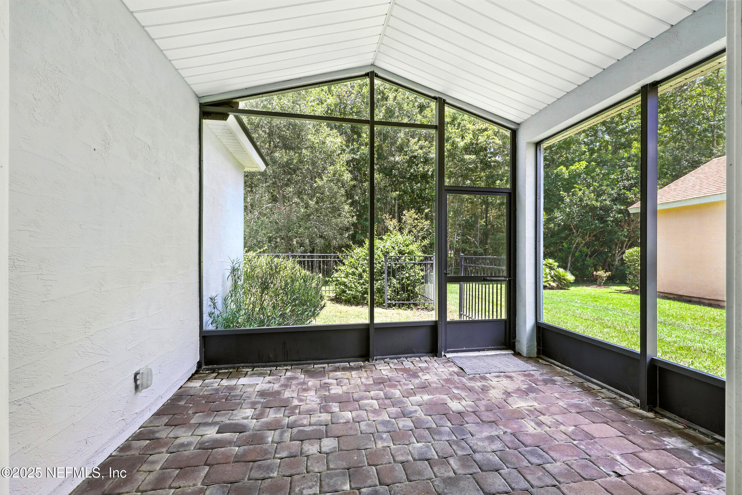 778 Copperhead Circle St. Augustine, FL 32092 - Photo 22 of 43 a view of a big room with a large window and front door