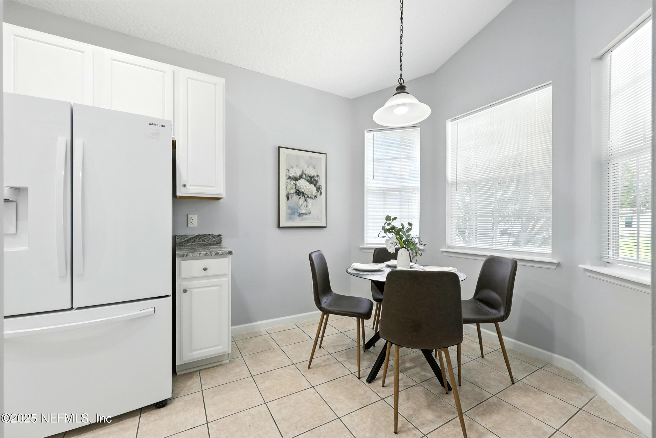 778 Copperhead Circle St. Augustine, FL 32092 - Photo 4 of 43 a dining room with furniture a window and a refrigerator
