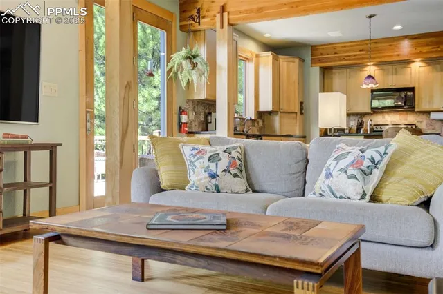a living room with furniture and a flat screen tv
