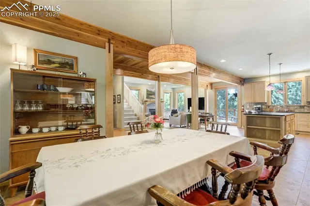 a large kitchen with a table and chairs in it