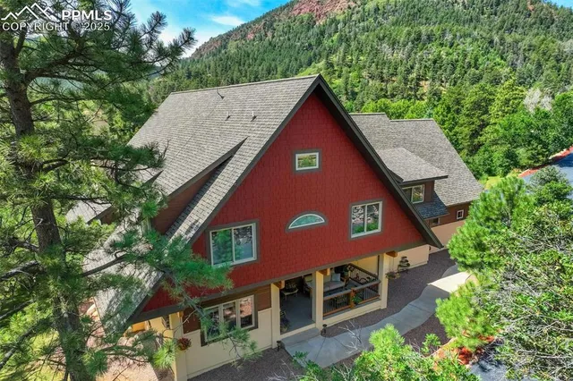 an aerial view of a house with yard