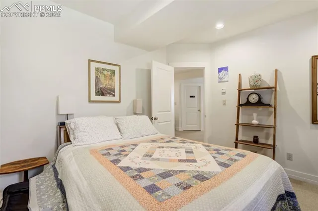 a bedroom with a bed and a cabinets