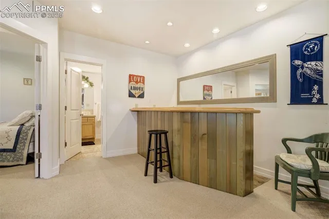 a view of entryway with workspace and bedroom
