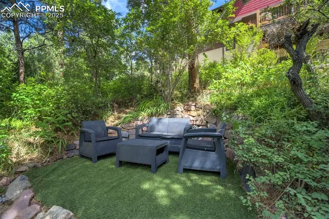 a backyard of a house with outdoor seating