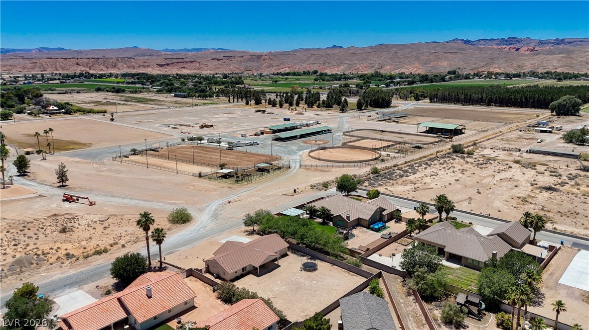 1272 Liston Avenue Logandale, NV 89021 - Photo 59 of 61 Discover a unique horse property with multiple riding arenas and ample land, framed by distant mountains.