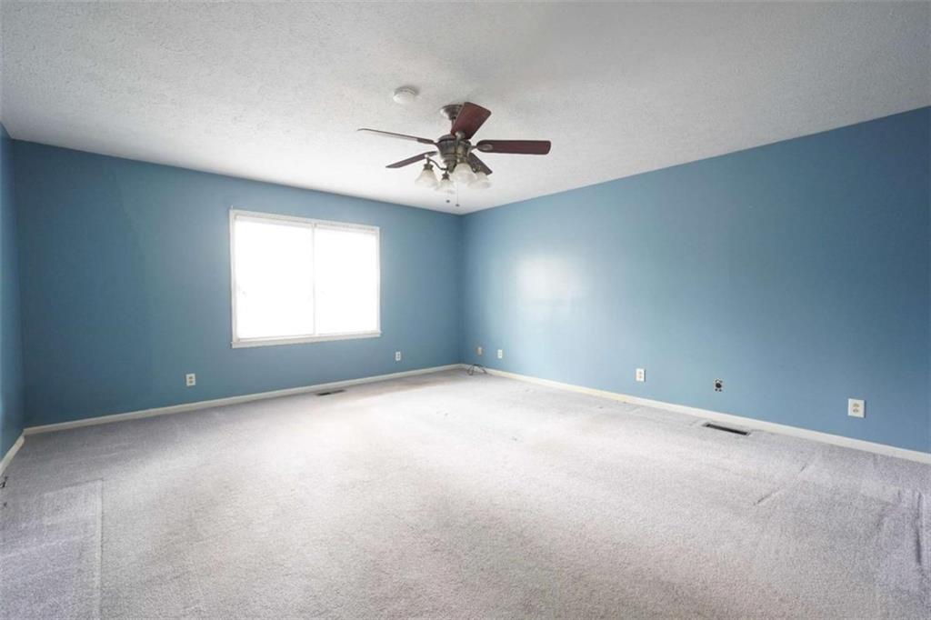 2058 Graham Road Macon, GA 31211 - Photo 17 of 37 an empty room with windows and ceiling fan