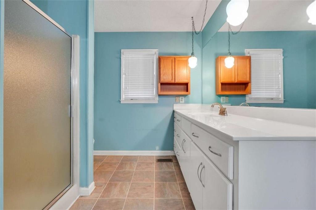 2058 Graham Road Macon, GA 31211 - Photo 20 of 37 a bathroom with a double vanity sink and mirror