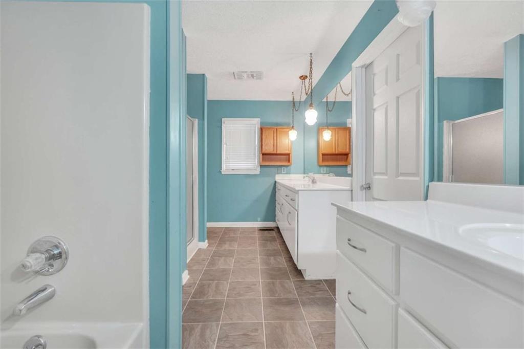 2058 Graham Road Macon, GA 31211 - Photo 25 of 37 a bathroom with a sink a toilet and mirror