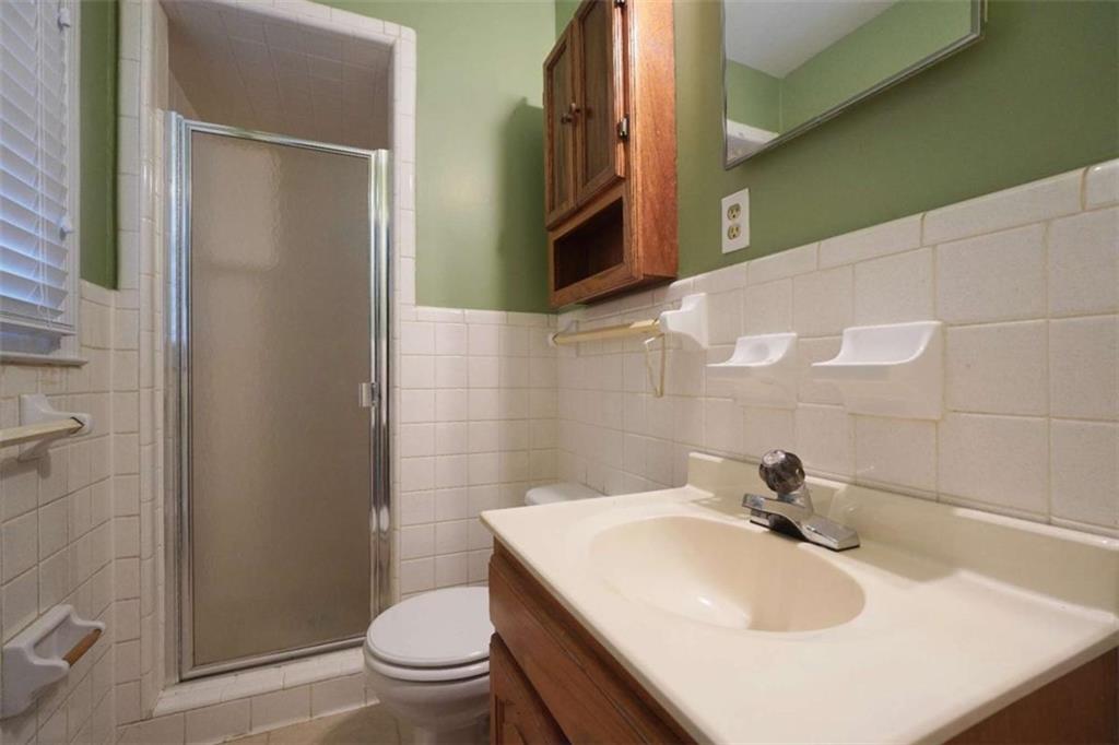 2058 Graham Road Macon, GA 31211 - Photo 28 of 37 a bathroom with a sink a toilet and shower