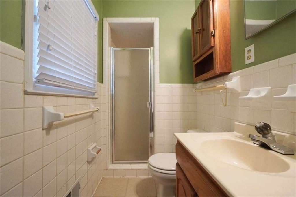 2058 Graham Road Macon, GA 31211 - Photo 29 of 37 a bathroom with a sink a toilet and shower