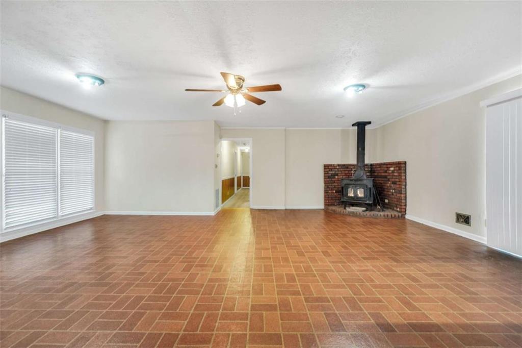 2058 Graham Road Macon, GA 31211 - Photo 6 of 37 a view of an empty room with a fireplace