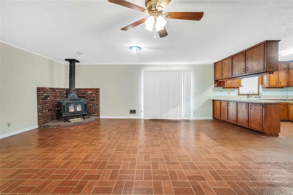 2058 Graham Road Macon, GA 31211 - Photo 7 of 37 a view of a livingroom with a staircase a kitchen area cabinets and a kitchen counter space