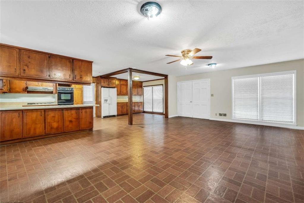2058 Graham Road Macon, GA 31211 - Photo 8 of 37 a view of a livingroom with furniture a ceiling fan and window