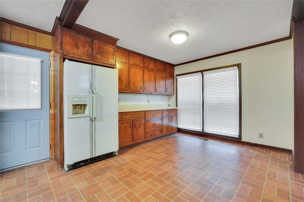 2058 Graham Road Macon, GA 31211 - Photo 9 of 37 an empty room with a cabinet and mirrors