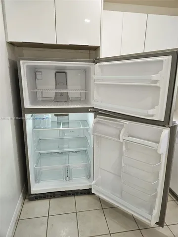 an empty room with white walls