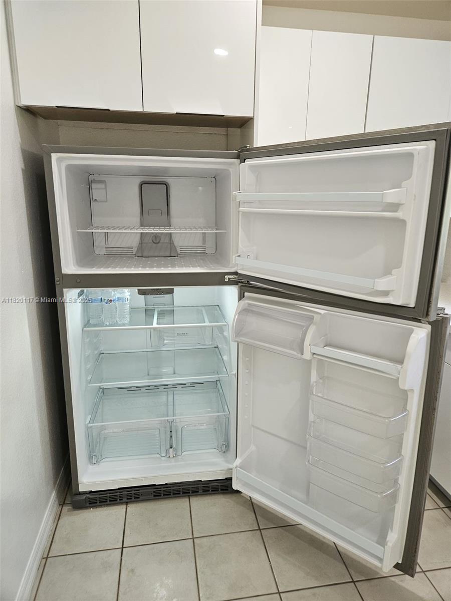 20137 Southwest 88th Court, Unit 20135 Cutler Bay, FL 33189 - Photo 13 of 33 a refrigerator in a kitchen