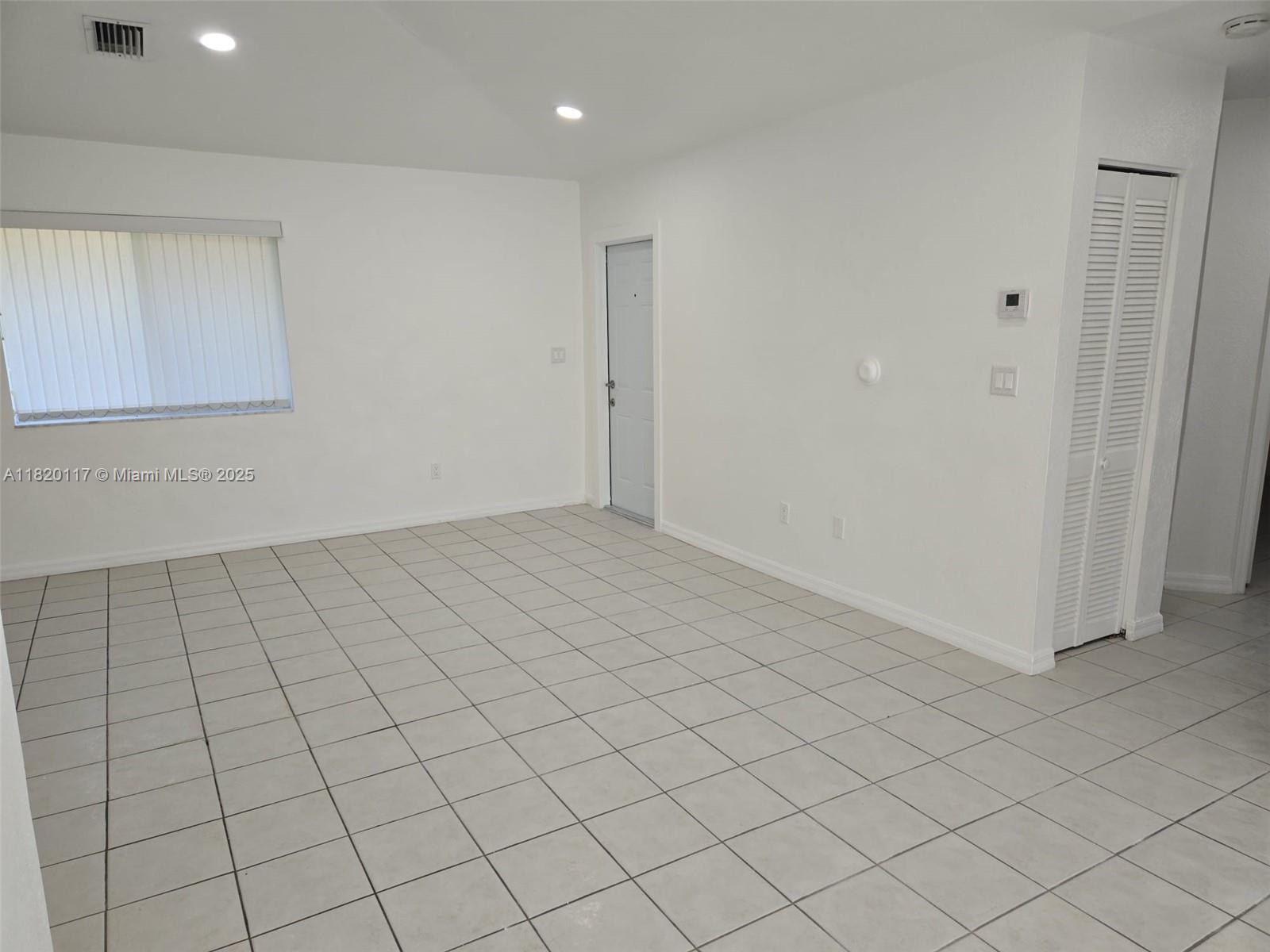 20137 Southwest 88th Court, Unit 20135 Cutler Bay, FL 33189 - Photo 15 of 33 an empty room with white walls