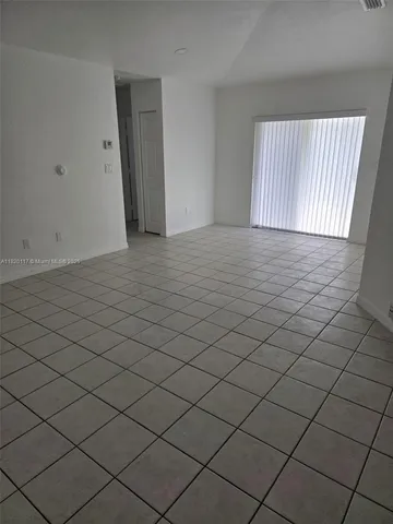 an empty room with white walls