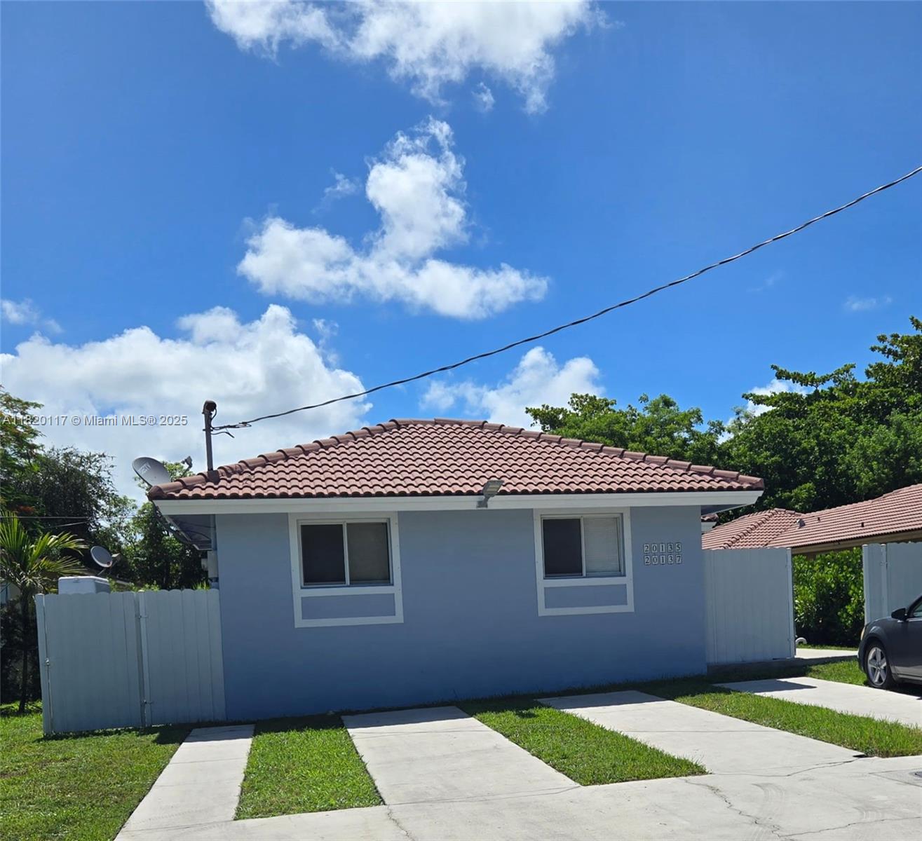 20137 Southwest 88th Court, Unit 20135 Cutler Bay, FL 33189 - Photo 2 of 33 a front view of a house with a yard