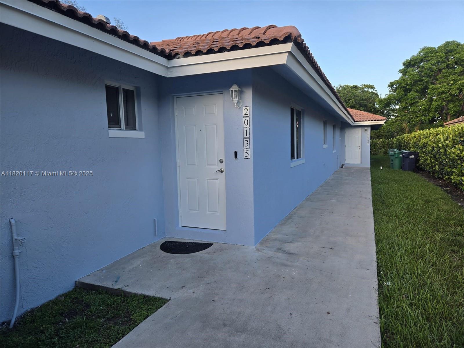 20137 Southwest 88th Court, Unit 20135 Cutler Bay, FL 33189 - Photo 23 of 33 a view of a backyard space