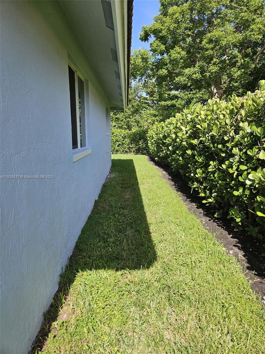 20137 Southwest 88th Court, Unit 20135 Cutler Bay, FL 33189 - Photo 28 of 33 a view of a garden