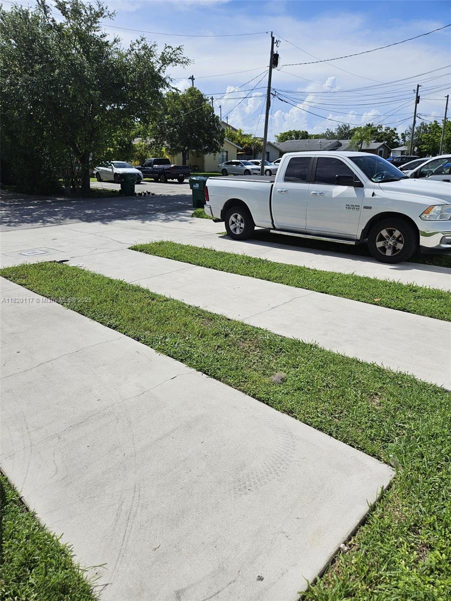 20137 Southwest 88th Court, Unit 20135 Cutler Bay, FL 33189 - Photo 31 of 33 a view of a car parked in the yard