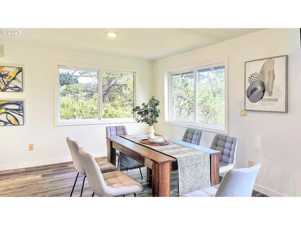 a dining room with furniture and window