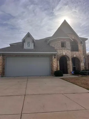 a front view of house with garage