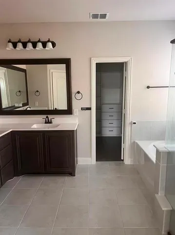 a living room with a table and a dresser