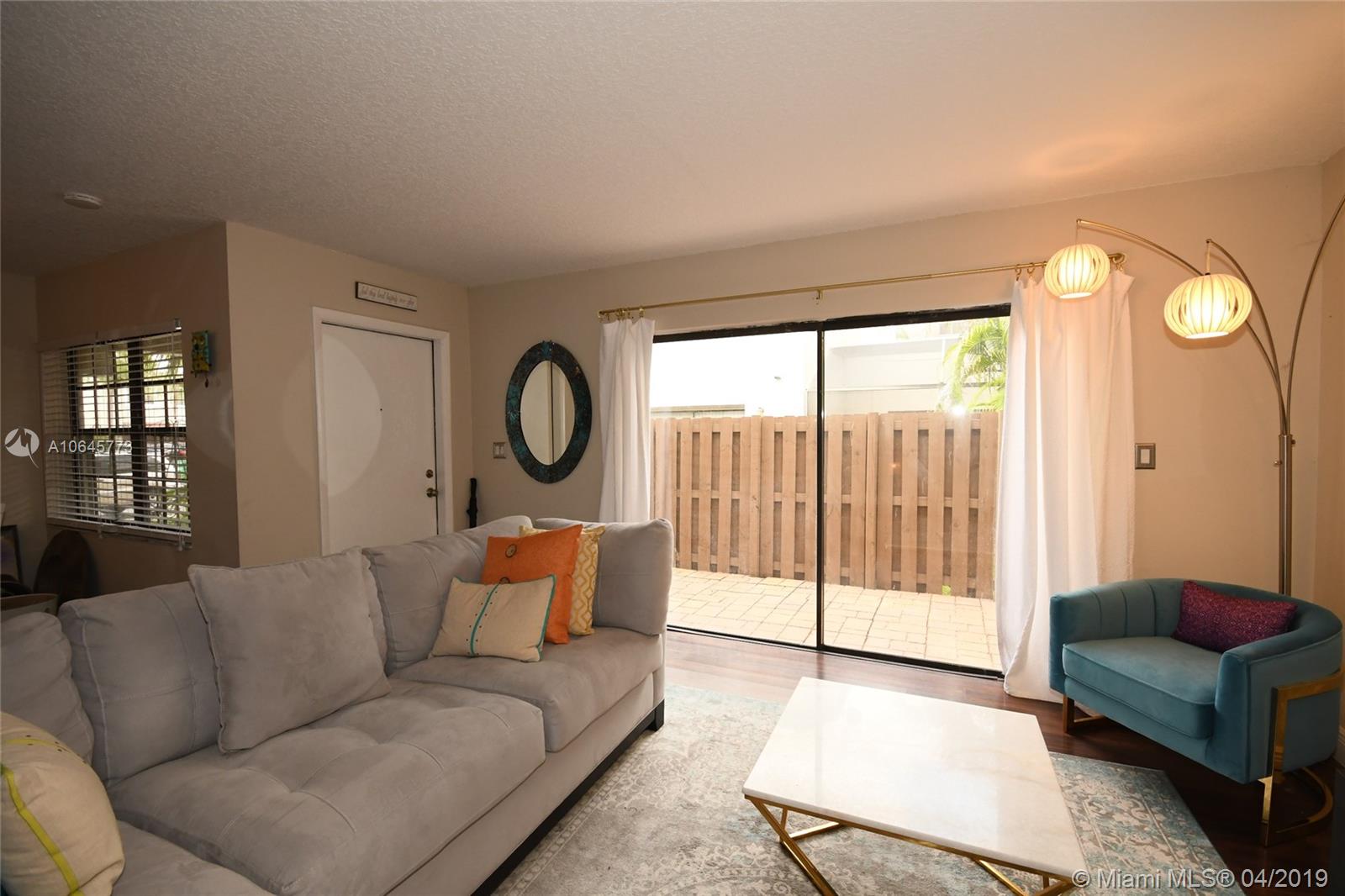 10475 Southwest 153rd Court, Unit 8 Miami, FL 33196 - Photo 12 of 65 Living Room to Front Door & Courtyard