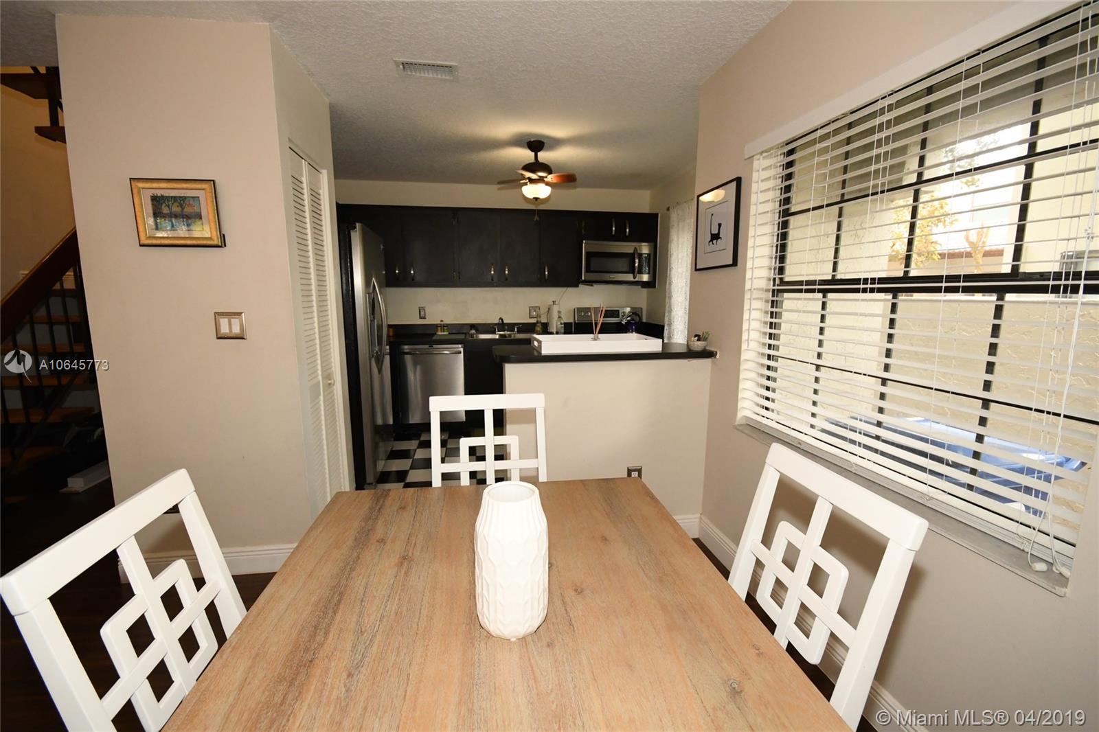 10475 Southwest 153rd Court, Unit 8 Miami, FL 33196 - Photo 20 of 65 Dining to Kitchen