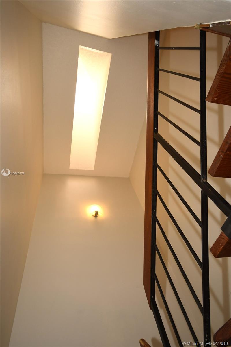 10475 Southwest 153rd Court, Unit 8 Miami, FL 33196 - Photo 30 of 65 Stairway Landing w/Skylight overhead