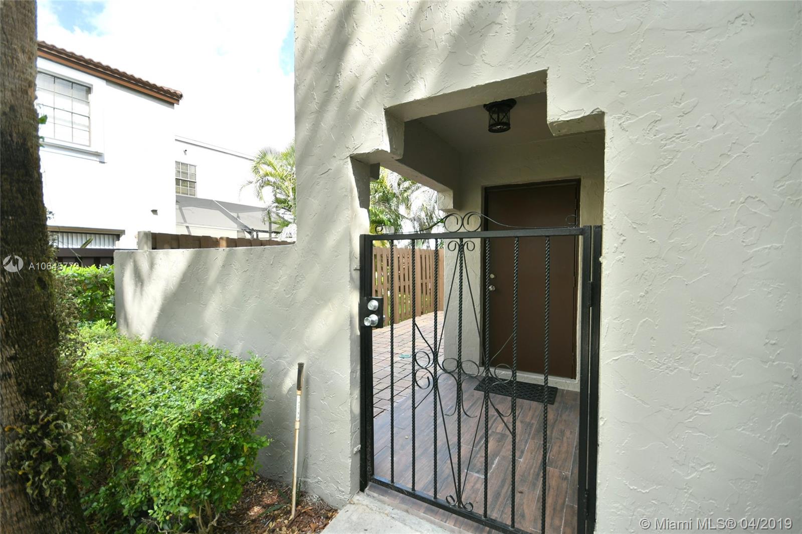 10475 Southwest 153rd Court, Unit 8 Miami, FL 33196 - Photo 5 of 65 Gated Courtyard Entry