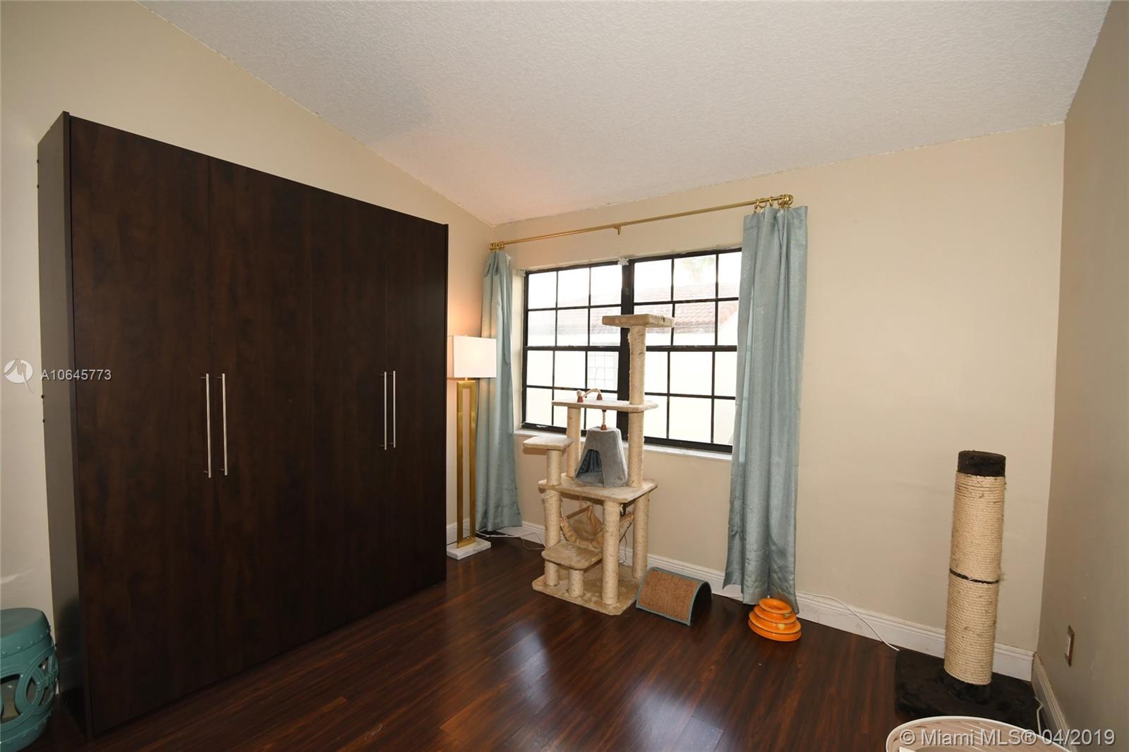 10475 Southwest 153rd Court, Unit 8 Miami, FL 33196 - Photo 44 of 65 Master Bedroom #2 w/Murphy Bed Included